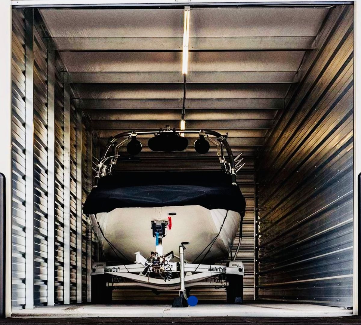 Boat stored inside enclosed storage unit in Houghton Lake